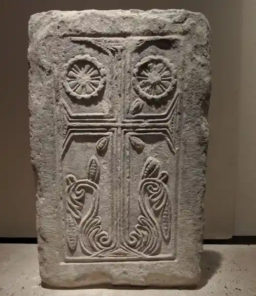 Marble closure slab decorated with relief foliate banded cross and rosettes